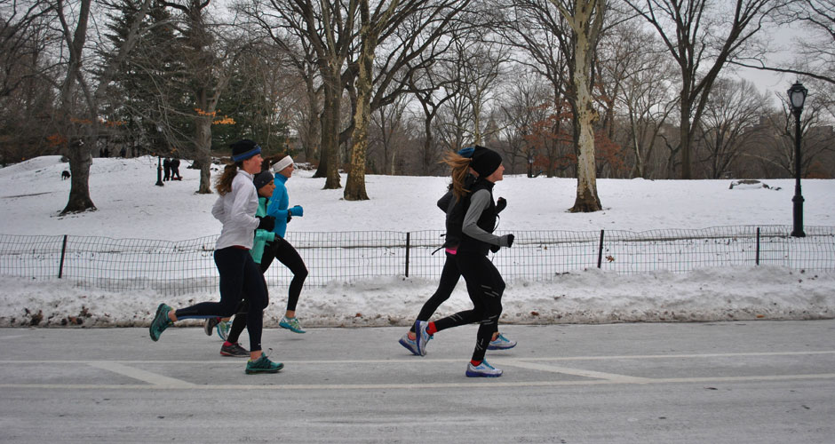 A pack of runners hits the pavement in New York City's Central Park despite the blustery weather. (Lucia De Stefani/NY City Lens)