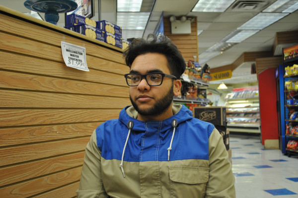 Brady Velasquez works in a supermarket and in a restaurant to pay back his debt and enroll back to college (Lucia De Stefani/NYCityLens)