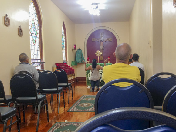 People praying in chapel