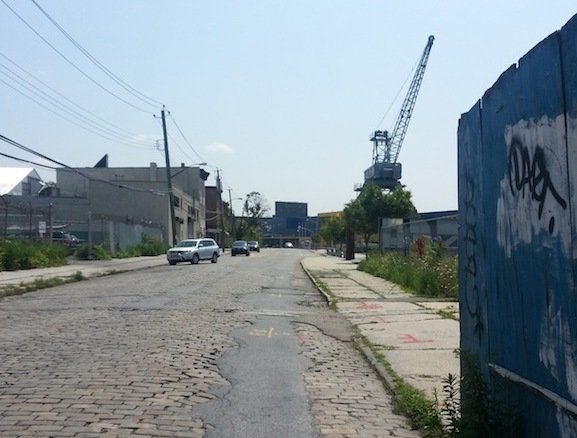 Beard Street in Red Hook, Brooklyn, a stone’s throw from industrial cranes at the last container port in Brooklyn. (Isabelle Niu/NY City Lens) 