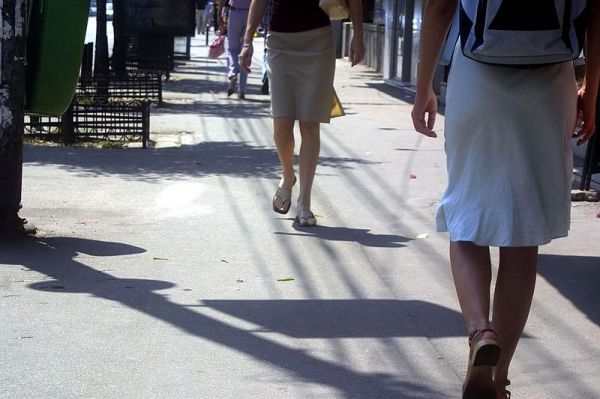 Women walk down an urban street, a place where many women report having experienced street harassment.  Photo/WikimediaCommons