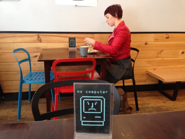 Inwood's Darling Coffee alerts customers to their unplug-from-technology seating policy.