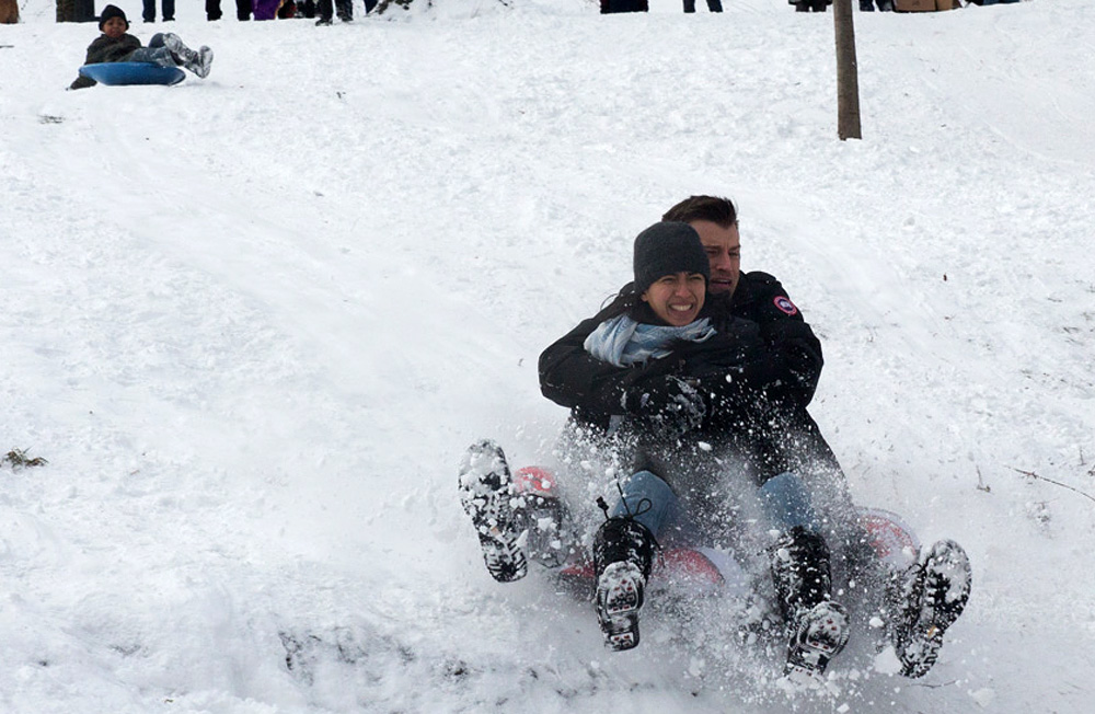 A couple sleds down the hill at St. Nicholas Park in Harlem on  January 27, 2015.