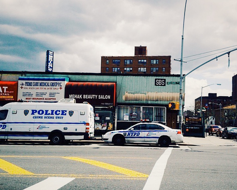 168th St, Jamaica, Queens. Police cars were parked outside Hillside Inn the day after the incident.