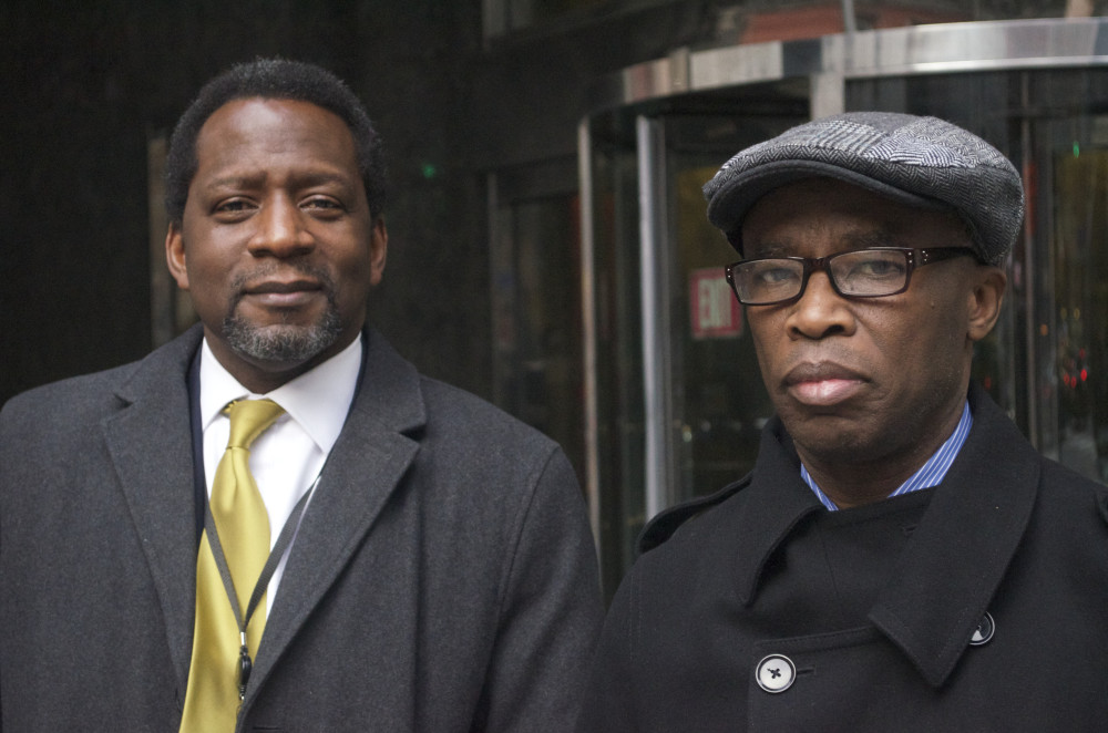 Martin Adamu and Olusegun Lewis reflect on Nigeria's big win at the Consulate General of Nigeria, NY (c) 2015 Ony Nwaohuocha.