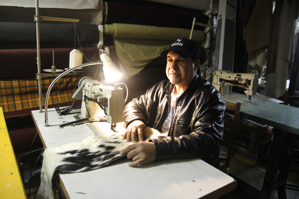 Arturo Olaya, inside his shop, Arthur’s Upholstery in Willets Point (Lauren Hard/ NY City Lens)