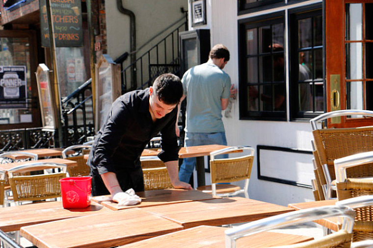 The Copper Still, an East Village bar, is putting out chairs and tables to welcome the spring.(Siyu Qian/NY City Lens)