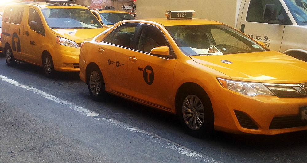  The Nissan NV200 (car in the rear) nicknamed "The Taxi of Tomorrow" will be the new iconic New York Taxi.