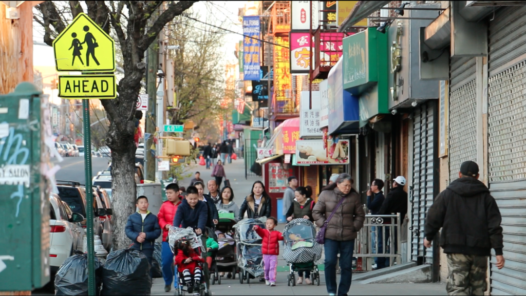 People walking on 7th Avenue in Chinatown, Brooklyn. (Siyu Qian/NYCity Lens)