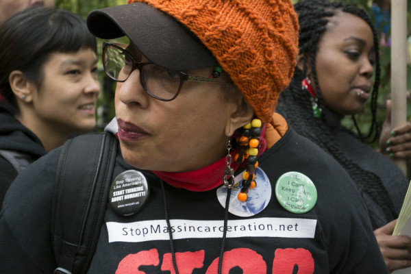 Maria Sanchez of Cambridge, MA, before the Rise Up October march in Manhattan on October 24, 2015. Sanchez is a member of the Revolutionary Communist Party.