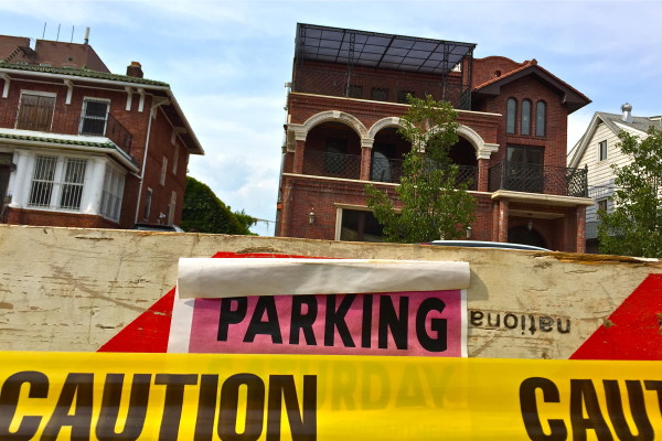 In Forest Hills, caution tape marks off many older houses and announces new construction ©Sasha Pezenik 2015