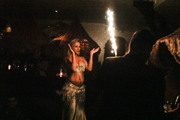 Birthday celebrations at Casa La Femme, Bellydancer Valerie chants for the party in the midst of her performance. ©Sasha Pezenik, 2015