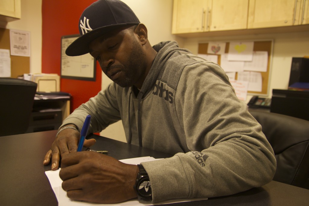 Khalid McKenzie, intervention specialist for United Playaz, in the office at Community Connections for Youth in Mott Haven, South Bronx. Photo: Oliver Arnoldi