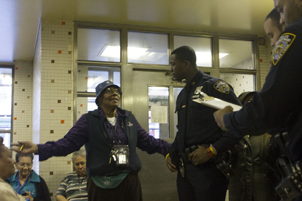 Officer Brown listens to a woman at a tenants' meeting in the South Bronx