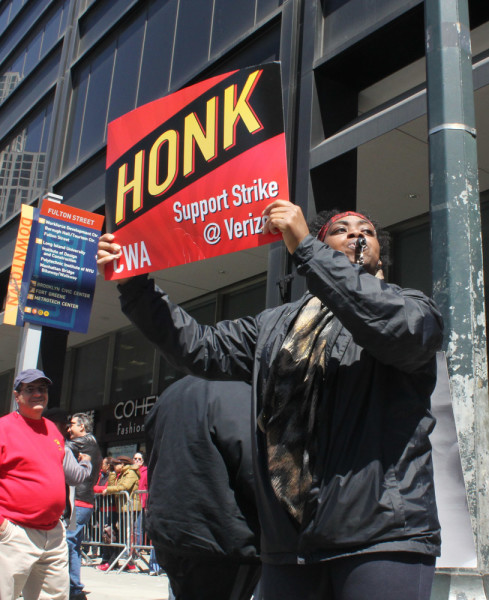 Lakesha Williams, who's worked at Verizon for 21 years, encourages passing traffic to get involved. (Simone McCarthy)