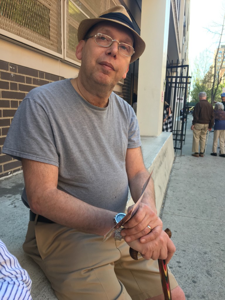 Marc Glazer sits outside of the voting poll on 84h and Columbus (Marybel Gonzalez)