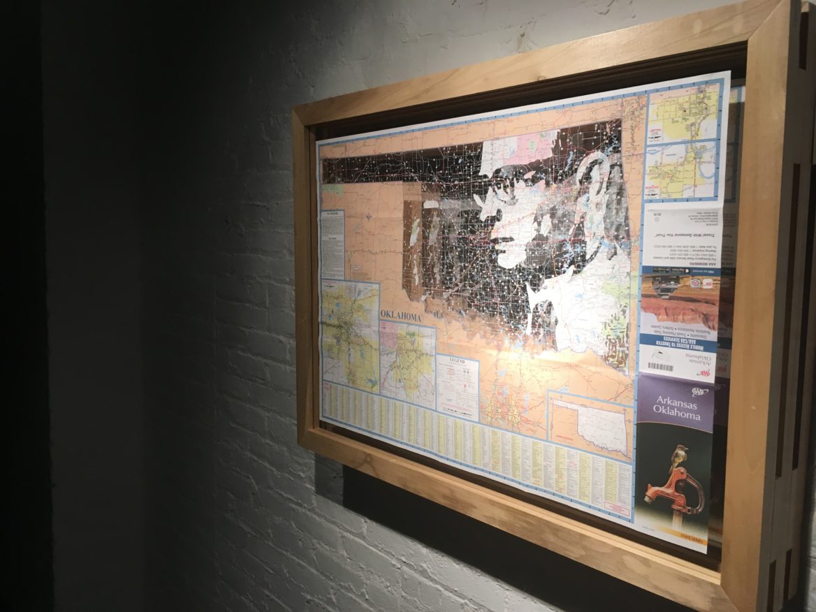 One of the smaller pieces at the 50 States show portrays Oklahoman playwright Lynn Rigg and a map of the state. 