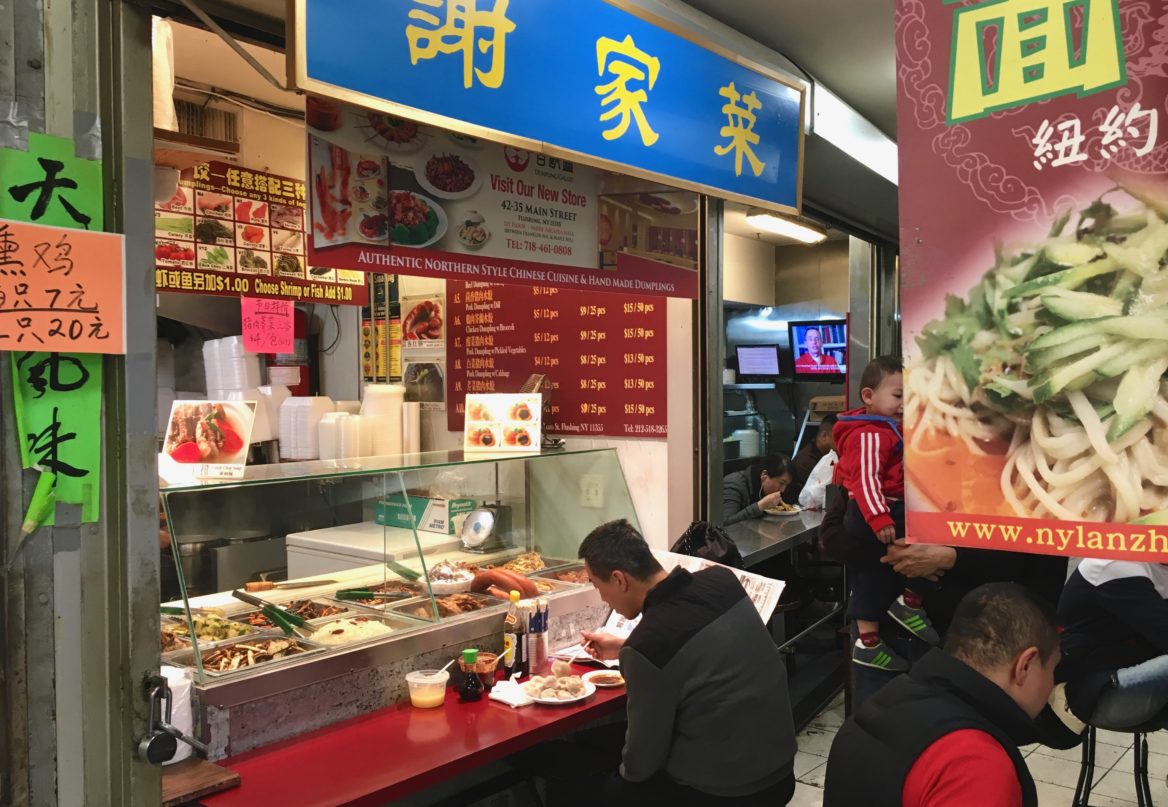 This food court in a inconspicuous basement in Flushing attracts hundreds of customers for its authentic take of street-style Chinese food(Keenan Chen/NY City Lens)