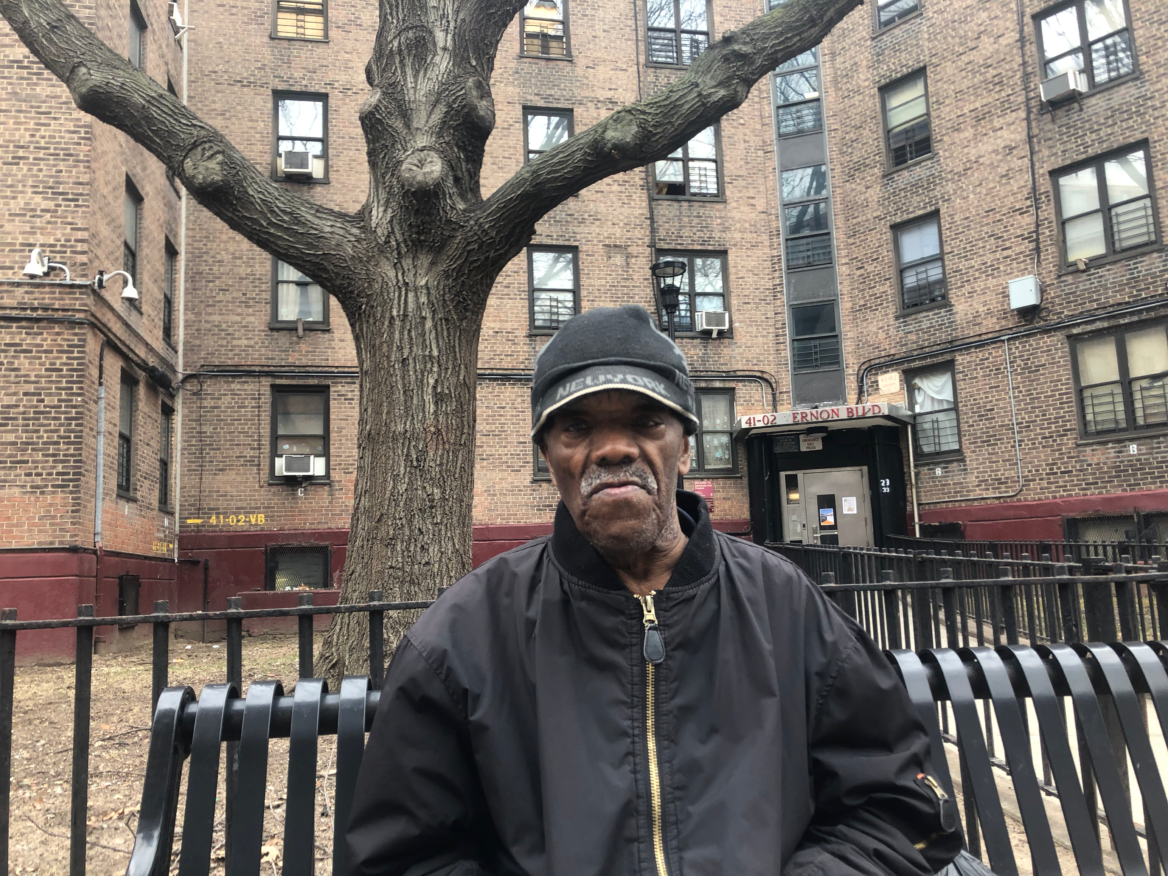 Moses Mims in front of Queensbridge Houses.