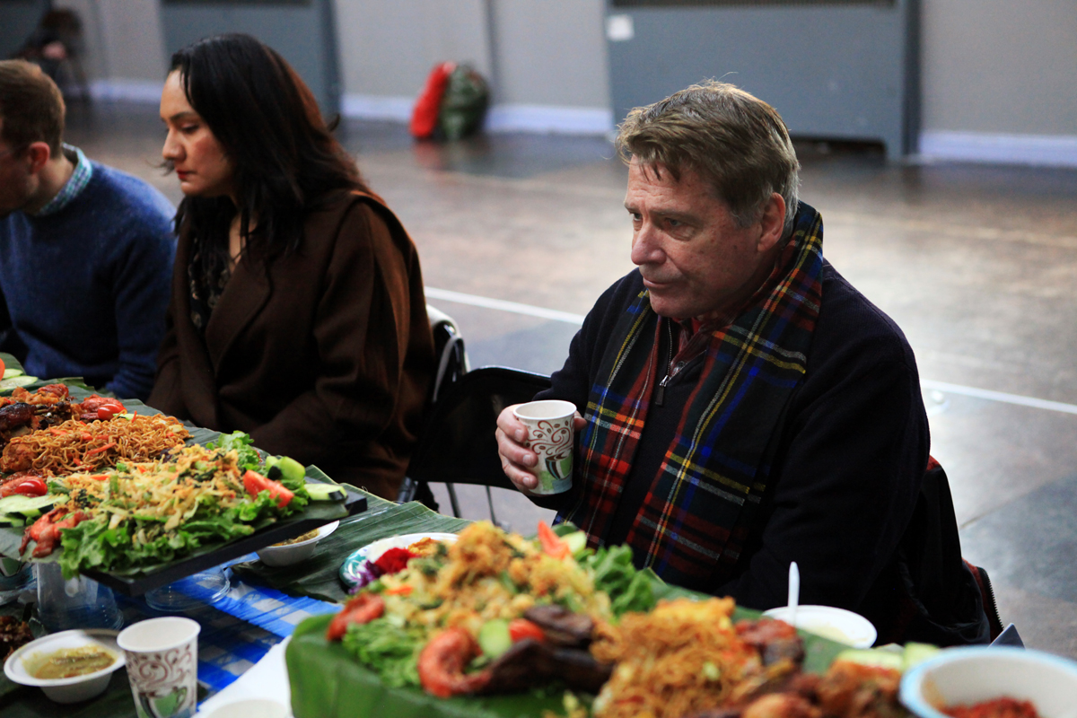Cameron Hume, 72, the former U.S. Ambassador to Indonesia serving from 2007 to 2010, enjoying food at the feast.
