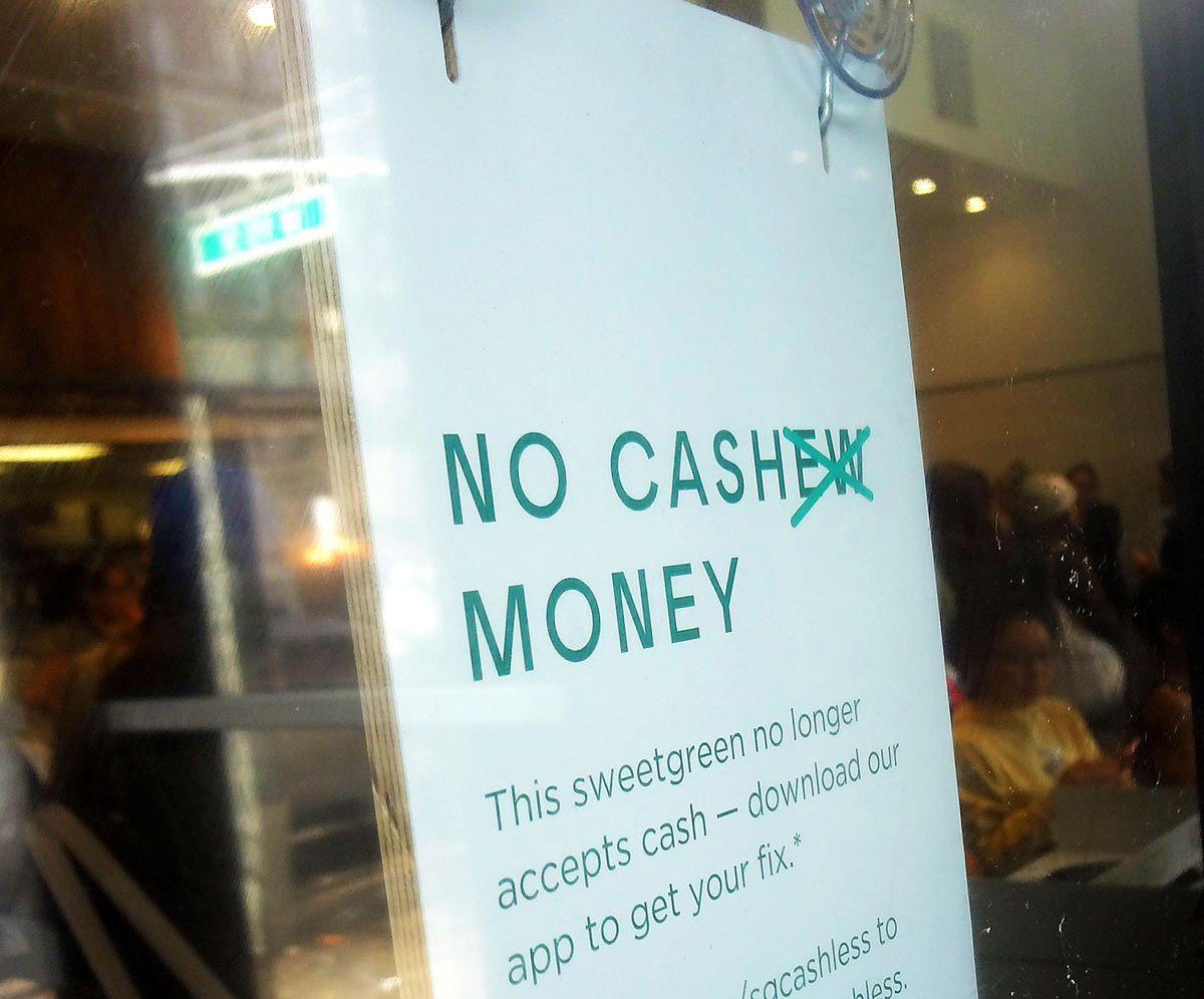 A sign at salad shop Sweetgreen informs customers the company no longer accepts cash for orders. It made the transition in 2017, one of a growing number of restaurants and shops in New York to do so. Concerned about leaving cash-carrying customers out in the cold, the City Council is currently considering a bill that would require retailers to reopen their registers.