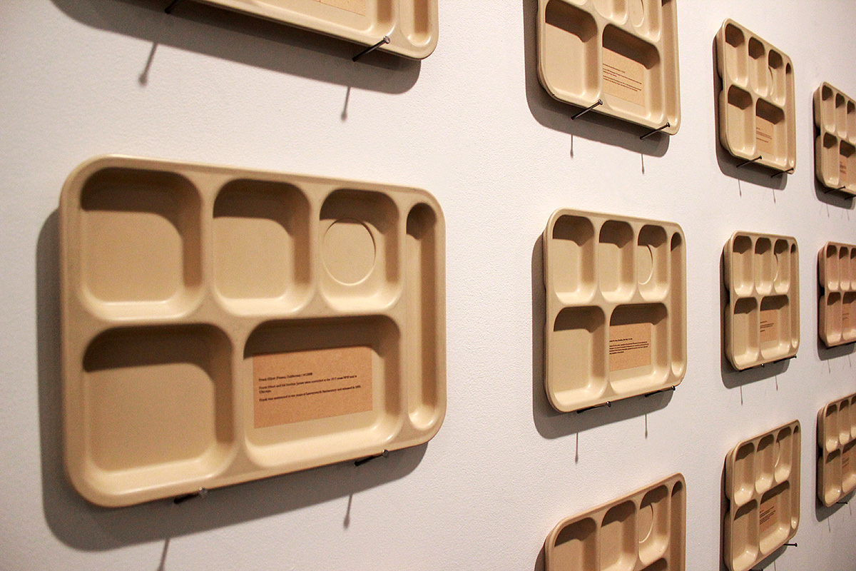 The Leavenworth Project: Memorial Trays, by Daniel McCarthy Clifford, made of reclaimed cafeteria trays and commemorating the incarceration of anti- war activists. (Emma Vickers/NYCityLens)