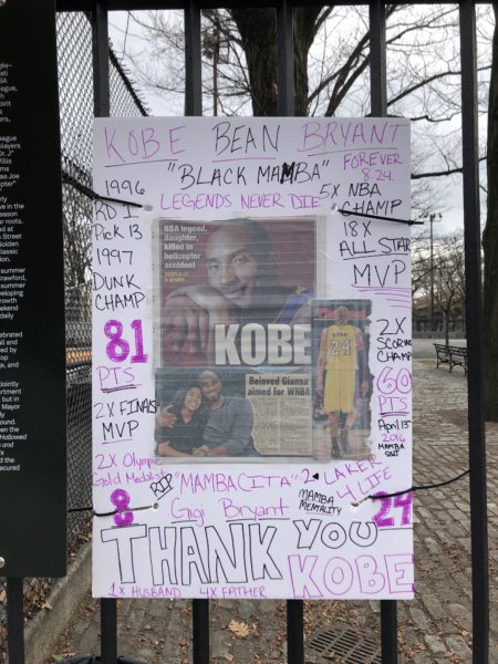 A Kobe Bryant tribute hangs in a park.