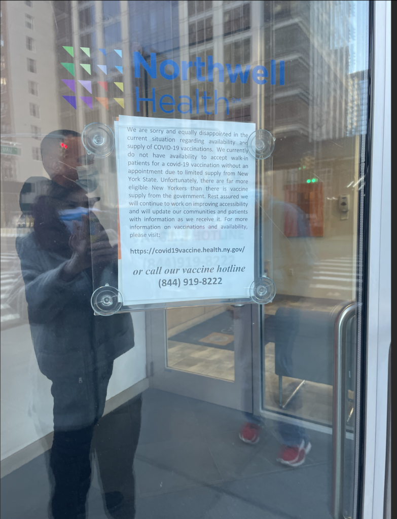 A sign at a vaccine distribution on 68th and Amsterdam states "There are far more eligible New Yorkers than there is vaccine supply from the government."