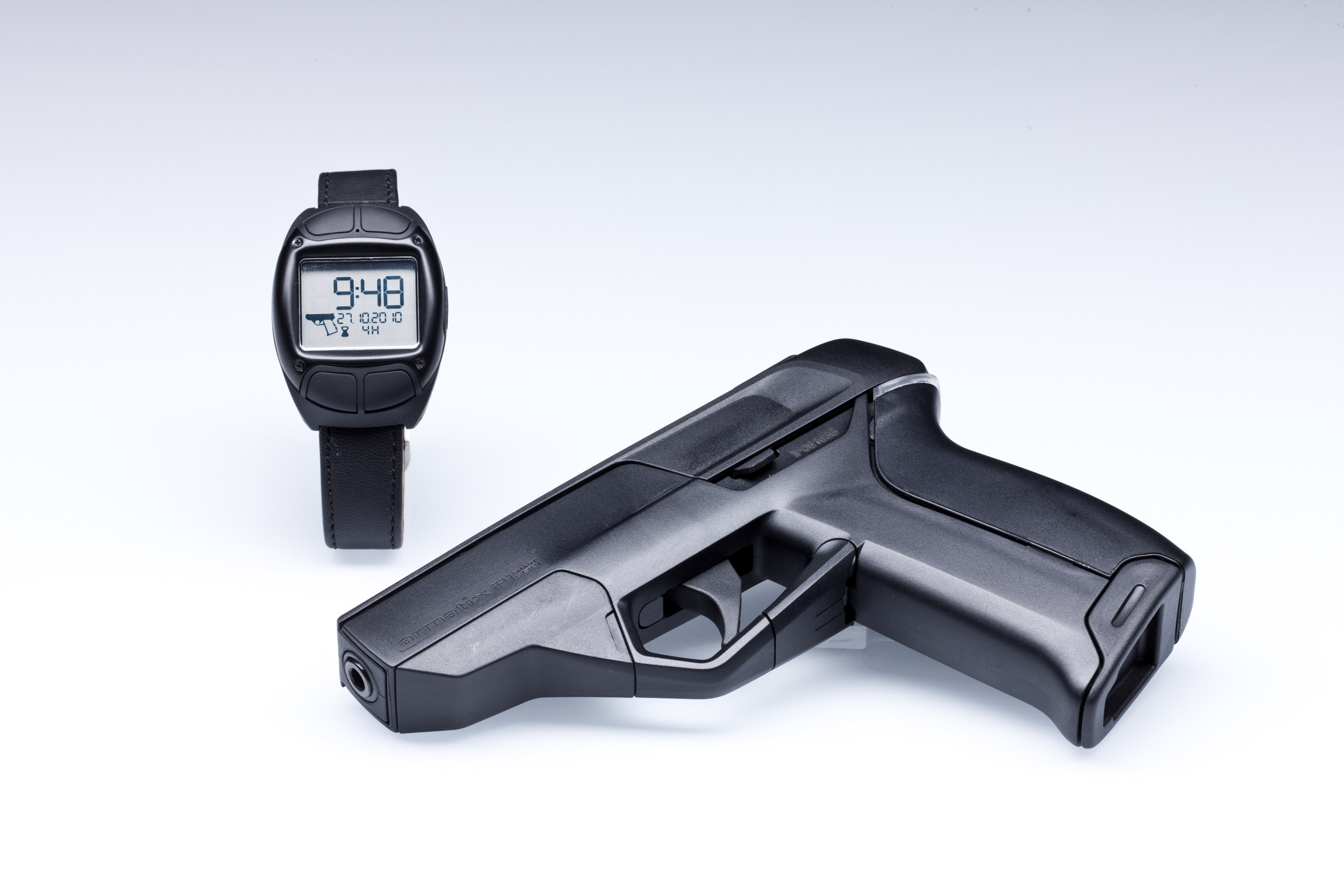 The iP1 smart gun with its radio frequency identification watch (courtesy of Armatix)
