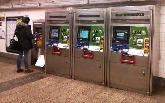 A man buys a Metro Card at the 34th Street – Herald Square Station in New York. (NYCityLens/Swati Gupta)