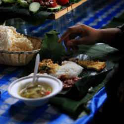 Liwetan is a traditional style of eating with banana leaves as a substitute for dishes.