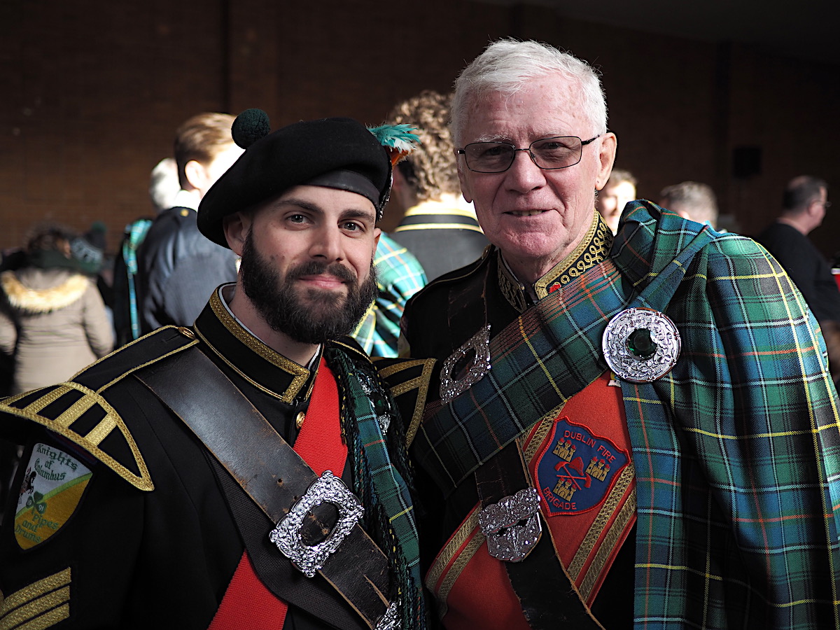 Matt Donovan and Bob Murphy Knights of Columbus Co. 126 Pipes and Drums marching band celebrate after the first St. Patrick's Day parade of the year in the Rockaways (Alice Chambers / NY City Lens)