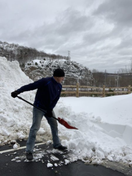 Rob Fletcher shoveling snow.