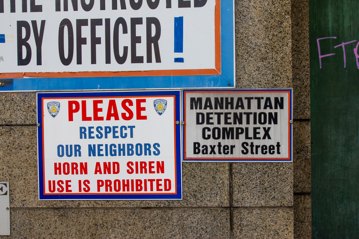 A sign on the Manhattan Detention Complex on Wednesday, February 23, 2022. Credit: Elizabeth Maline for NY City Lens.