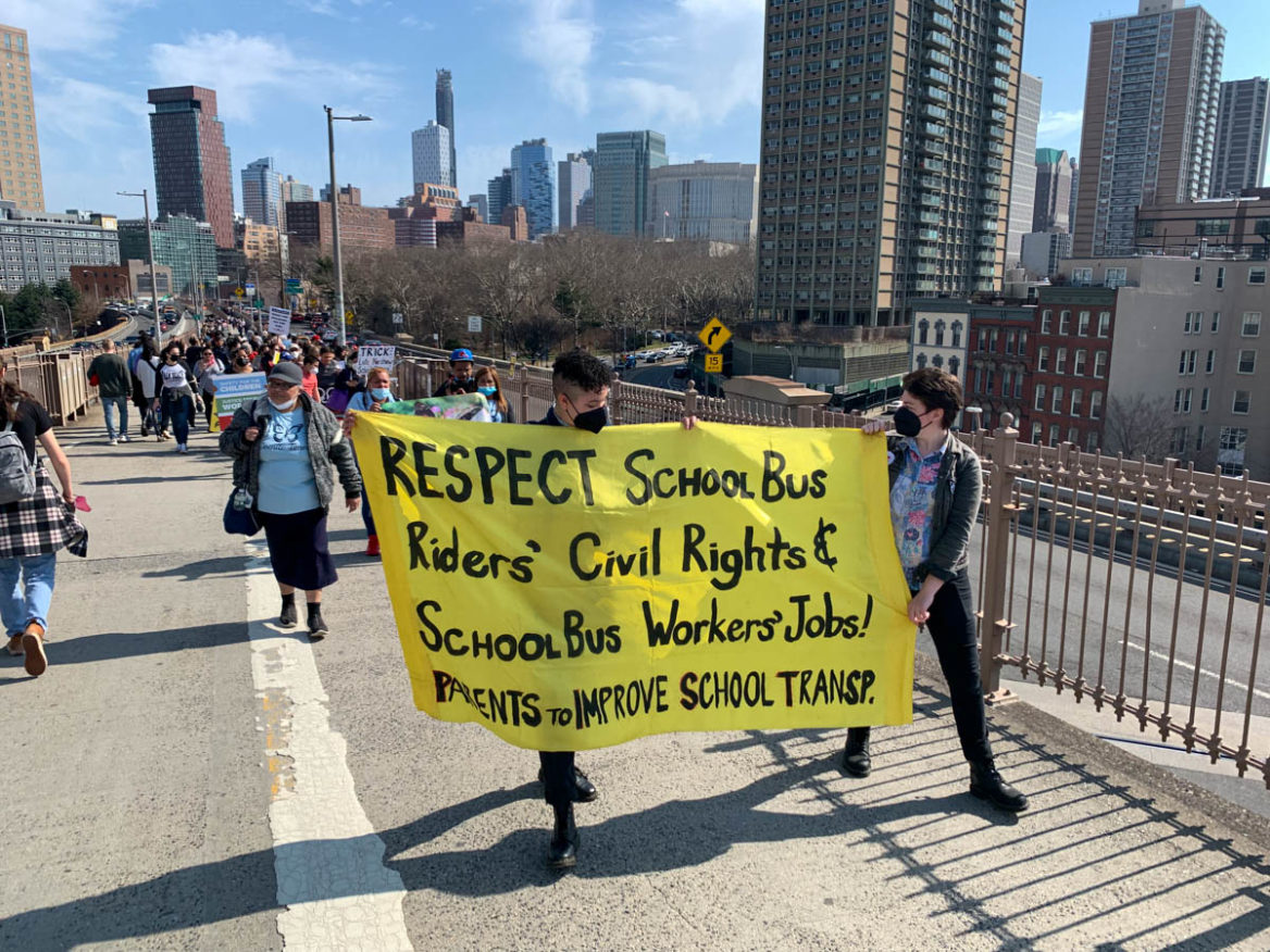 In protest, advocates walk toward the Brooklyn Bridge, calling for transportation inclusion, equity, and reform for students, particularly those with disabilities and bus workers. Mar 19, 2022. (Photo by Eleonora Francica for NY City Lens)