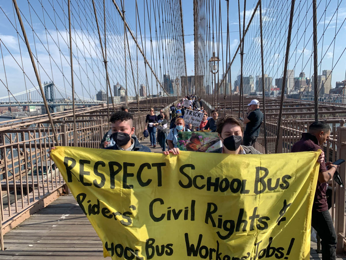 Advocates, parents, bus drivers, and children march over the Brooklyn Bridge, calling for transportation inclusion, equity, and reform for students and bus workers. Mar 19, 2022. (Photo by Eleonora Francica for NY City Lens)